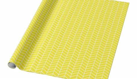 a yellow and white chevroned pattern wrapping paper on a white