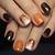 Artistic Autumn Hues: Short Nail Art Ideas with Abstract Colors