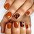Autumnal Bliss: Fall in Love with Stunning Burnt Orange Nail Inspirations