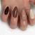 Embody the Mystery: Dark Brown Nail Art for an Enchanting Look!