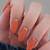 Fall Fingertip Glamour: Adorn Your Nails with Striking Burnt Orange Designs