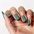 Intricate Details: Delight in the intricate beauty of dark green fall nail designs