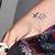 Kelly Clarkson Cross Tattoo