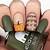 Lush Fall Tones: Embrace the richness of the season with dark green fall nail art