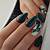 Mystical Shadows: Explore the mystical side of fall with dark green nail art