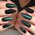 Regal Exuberance: Exude opulence and grandeur with dark green nails