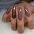Rich and Chic: Enchanting Chocolate Brown Nail Ideas