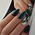 Sleek and Chic: Elevate your fall style with sleek dark green nail art