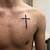 Small Cross Tattoo On Chest