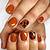 Sweater Weather Glam: Nail the Look with Beautiful Burnt Orange Nails