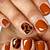 Warm and Cozy: Embrace the Season with Stunning Burnt Orange Nails