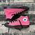 black and pink high top converse