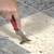 removing vinyl floor adhesive from concrete