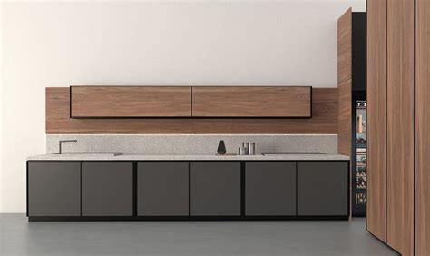 A Modern Kitchen With Two Sinks And Cabinets In It S Center Area Next To An Open Door