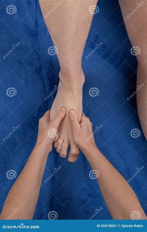 Close Up Of Female Masseuse Giving A Foot Massage To Man Stock Image Image Of Slackening