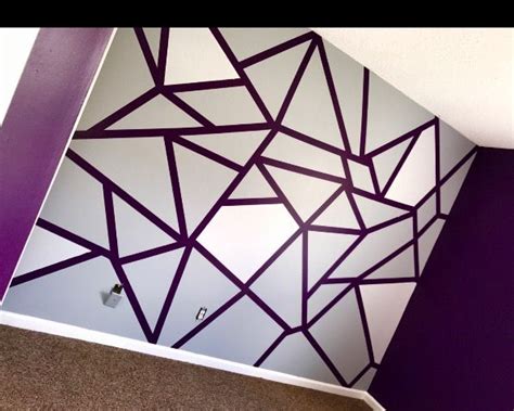 These dark wood accented walls are super cool and are an easy way to make a space feel homey but with there is no taping, painting, or really even that much planning required to mount this super cool geometric design. frog tape wall design 🐸😁 | Wall paint designs, Bedroom ...