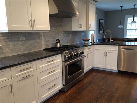 As its name suggests, steel grey granite has the rugged charm of the industrial age. Counters are polished "Steel Gray" granite. Backsplash is "Carrara Random Tile" honed white. The ...