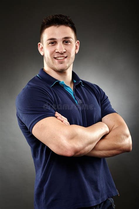 Handsome Young Man With Arms Folded Stock Photo Image Of Cheerful