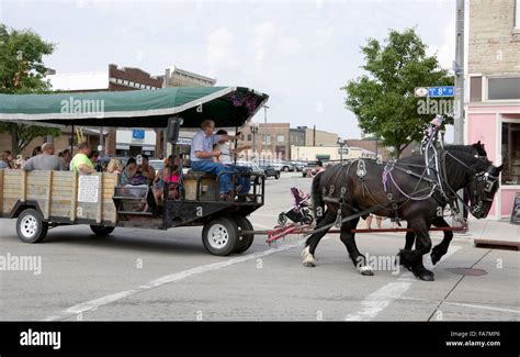Horse Drawn Wagon Rides During Street Fair In Manitowoc Wisconsin