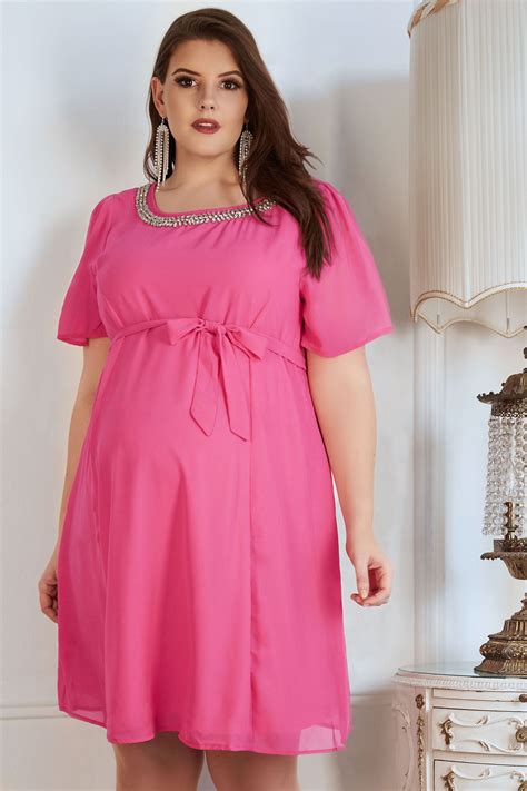 Bump It Up Maternity Pink Chiffon Dress With Jewel Embellished Neckline And Self Tie Waist Plus Size
