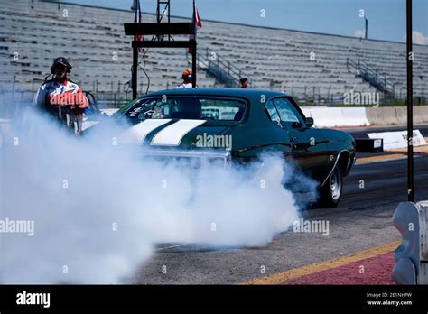Chevrolet Chevelle Performing A Burnout At Drag Strip Stock Photo Alamy