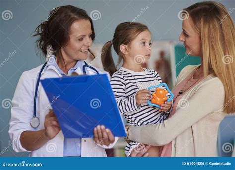 Mother With Baby Girl At Doctor S Office Stock Photo Image Of Group