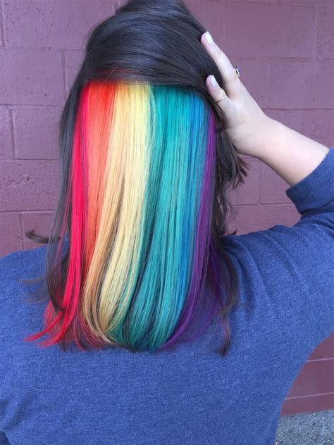 It's a new year now, people usually feel like getting a fresh new look that will not only reinvigorate their appearance. Picture Of medium length black hair with rainbow peekaboo highlights that impress