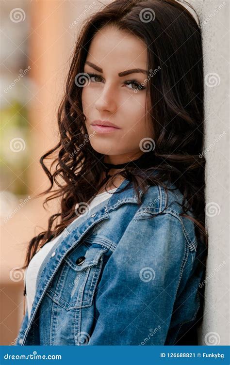 woman with brown hair in denim jacket posing on camera stock image image of adult cute 126688821