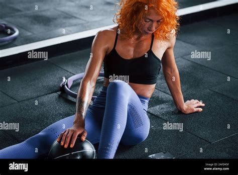 Sitting And Taking A Break Sporty Redhead Girl Have Fitness Day In Gym At Daytime Muscular