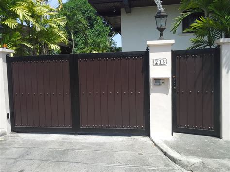 Installing house red metal fence with garage gate of. Steel and Wood Gate | Cavitetrail, Glass Railings ...