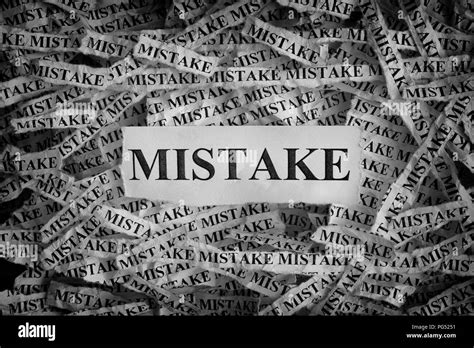 Mistake Torn Pieces Of Paper With The Word Mistake Concept Image