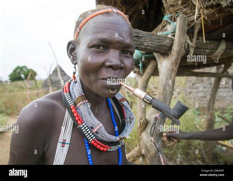 Toposa Tribe Woman Smoking Pipe In A Village Namorunyang State