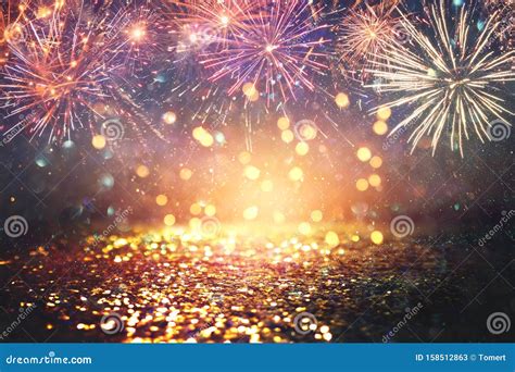Abstract Gold Black And Blue Glitter Background With Fireworks