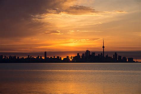 First Sun Rays Toronto Skyline At Sunrise Photograph By Georgia