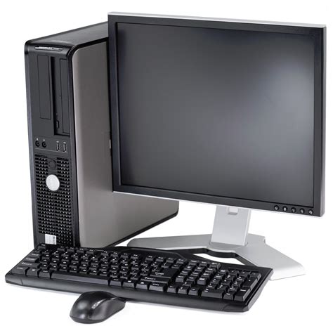 A Desktop Computer Sitting On Top Of A White Desk Next To A Keyboard