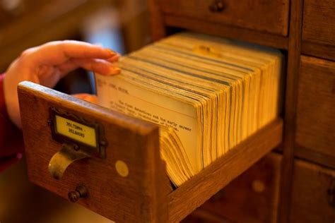 This is a wooden library card catalog cabinet with 60 drawers. The Last Library Card Catalog Cards - Neatorama