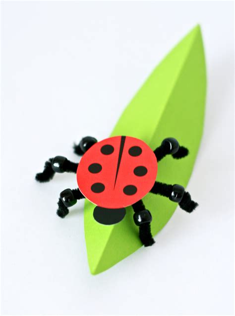 Paint a rock to look like a ladybug: Paper Ladybug Craft - Paging Supermom