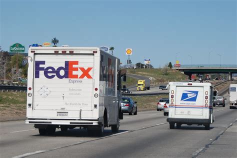 Fedex Express Delivery Truck And United States Postal Service Usps Llv