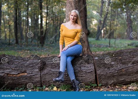 Young Blonde Woman In The Forest Enjoying Nature Stock Image Image