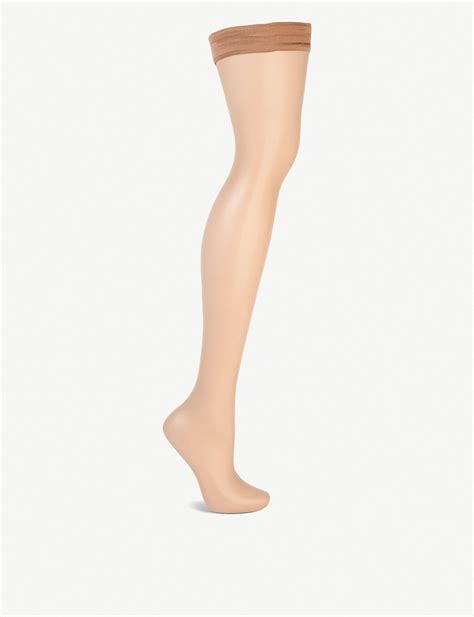 wolford synthetic naked 8 hold ups in caramel black lyst