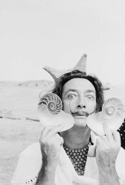 Spanish Surrealist Artist Salvador Dali 1904 1989 Holds Up Two