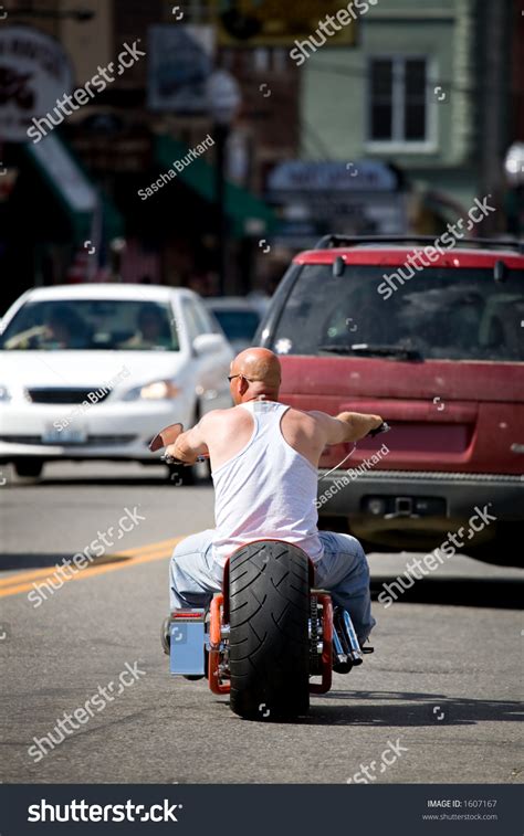 Biker Dude Man Without Helmet Riding His Chopper Downtown Stock Photo
