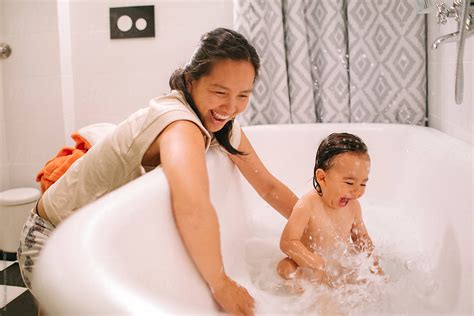 Mother Bathing Her Baby By Stocksy Contributor Ani Dimi Stocksy