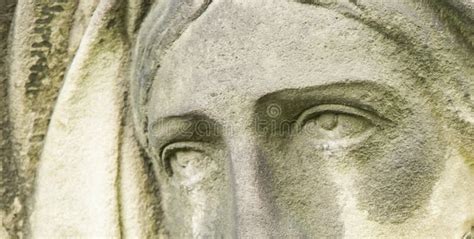 Dramatic Eye View Of Virgin Mary Fragment Of An Ancient Stone Statue Of Sad Woman In Grief