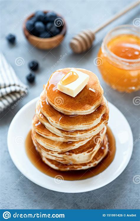 It gives taste to your food. Fluffy Buttermilk Pancakes With Butter And Syrup Stock ...