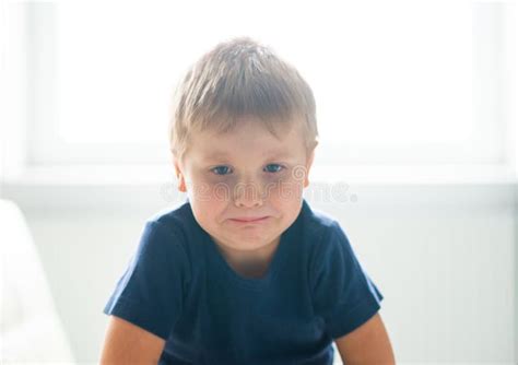 Portrait Of Hysterical Boy Upset Caucasian Kid Crying At Home Stock