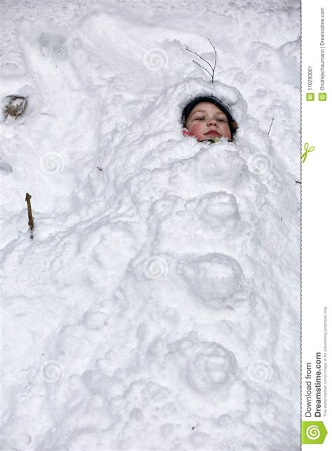 Little Boy Covered By Snow With Only Face Visible Stock Image Image