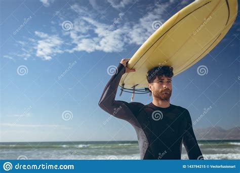 Male Surfer Holding Surfboard At Beach Stock Image Image Of Surfer