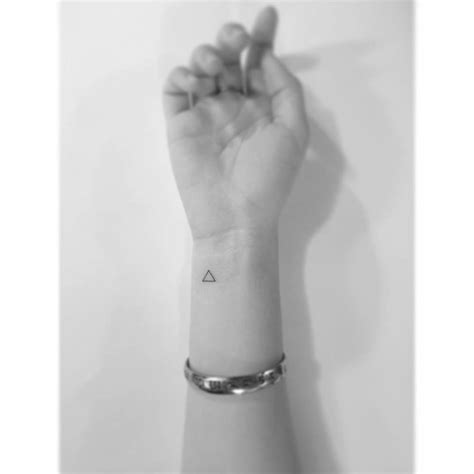 Minimalistic Triangle Tattoo Located On The Wrist