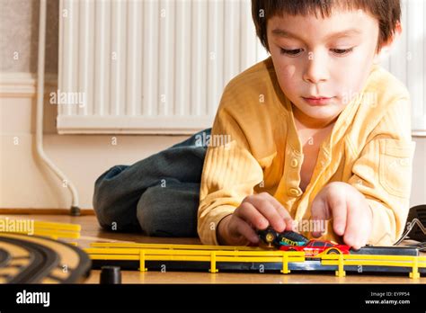 Caucasian Child Boy 6 7 Year Old Indoors Laying Down On Wooden